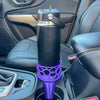 A purple car cup holder adapter holding a 26 oz yeti water bottle