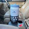 A Stanley 64oz ice flow jug in a 3D printed car cup adapter